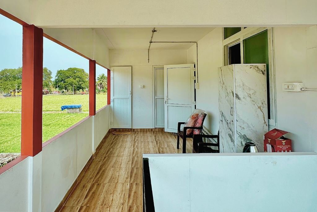 First floor with a balcony facing the Velliangiri Hills